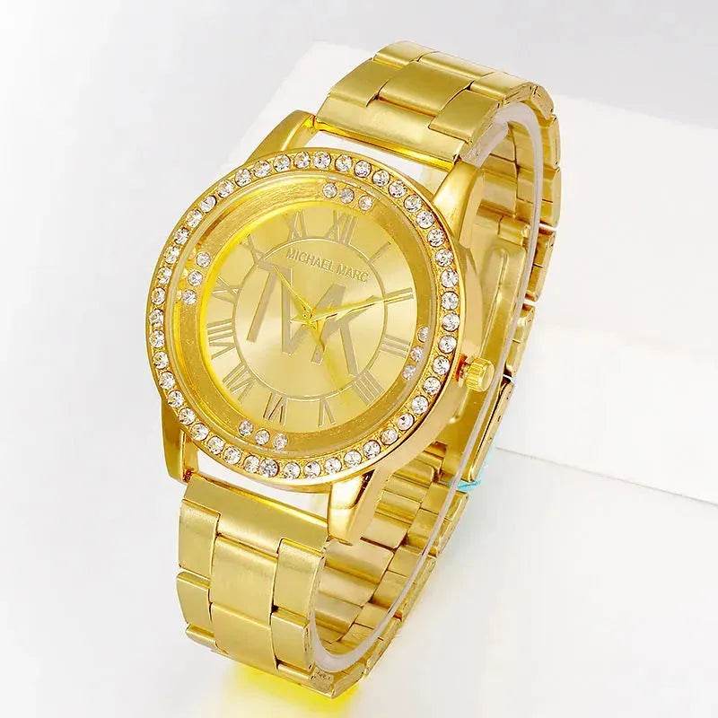 Gold metal band watch with rhinestone bezel and Roman numeral dial