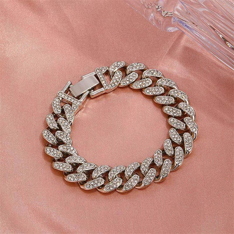 Silver cuban chain bracelet with oval diamond-look links and hinge clasp