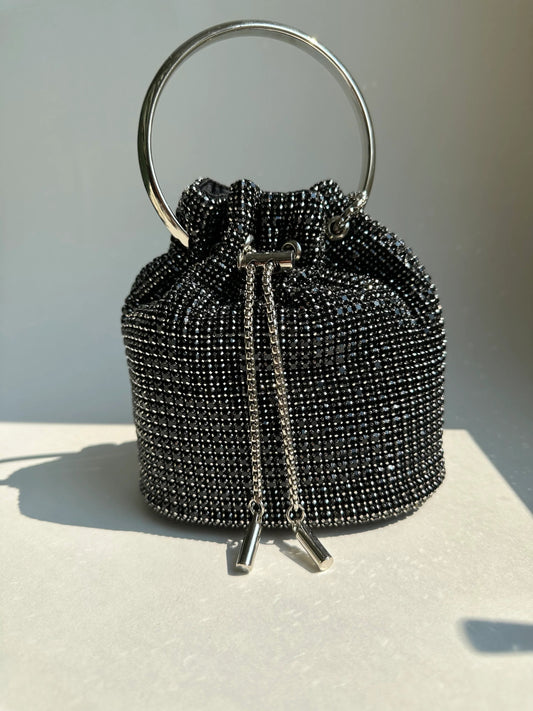 Black rhinestone bucket bag with ring handle and zipper pulls