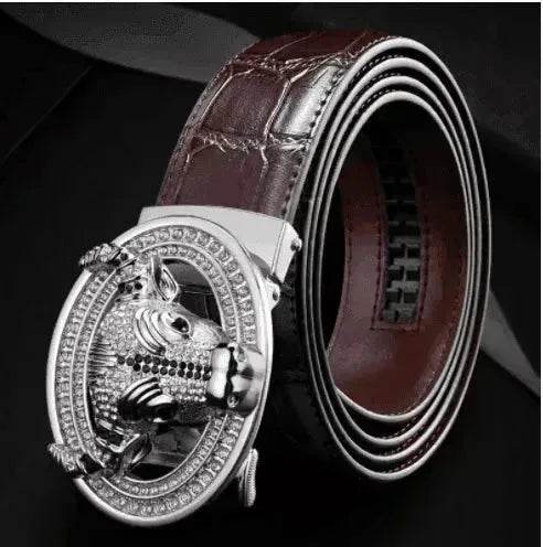 Silver-tone diamond-studded bull head automatic buckle on dark brown leather belt