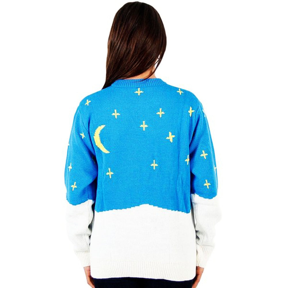 Back view of blue sweater with moon and plus-star pattern, white ribbed cuffs/hem