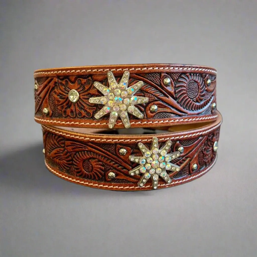 Brown embossed leather belt with two rhinestone star appliques and decorative studs
