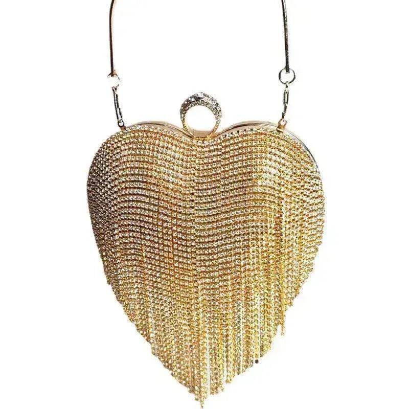 Gold heart-shaped beaded tassel handbag with curved frame, top handles, and center ring