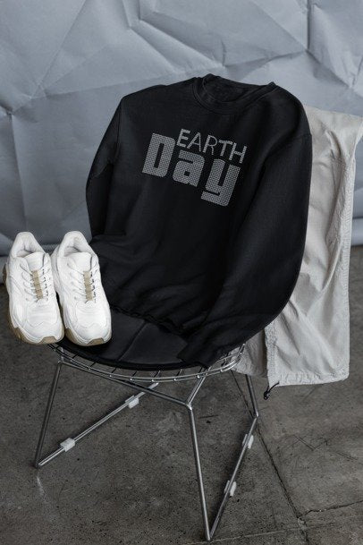 Black sweatshirt with rhinestone-style 'Earth Day' text on front.