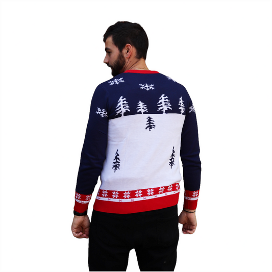 Snow-themed sweater back with dark blue sleeves, white center, red cuff trim, trees
