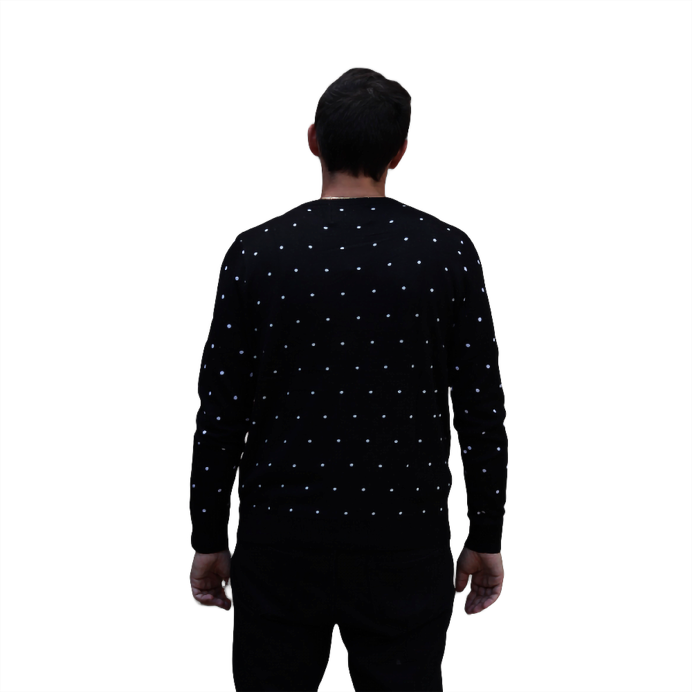 Back view of black crewneck sweater with white snow speckles pattern.