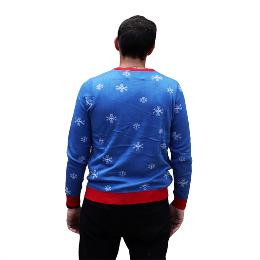 Blue holiday sweater back with small white snowflake pattern, red hem and cuffs
