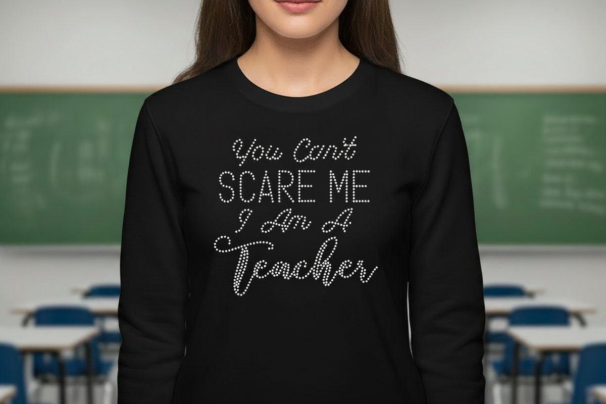 Black rhinestone teacher long-sleeve shirt with 'You can't scare me I'm a teacher' text