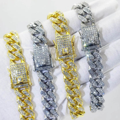 Set of gold and silver diamond Cuban link bracelets with rectangular clasps.