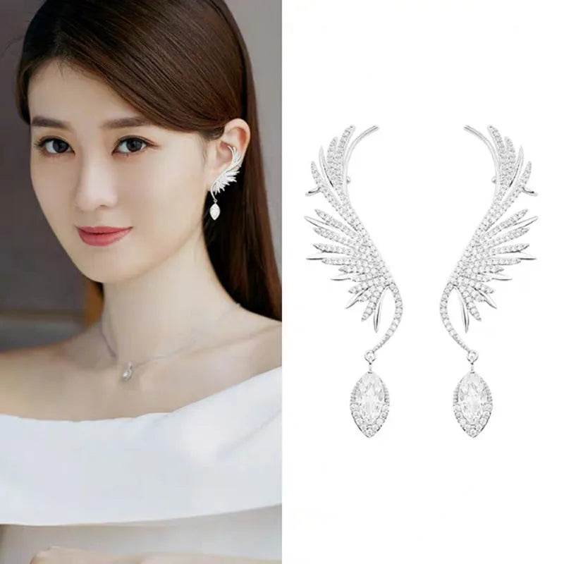 Silver angel wing ear bone clip earrings with teardrop dangling stones