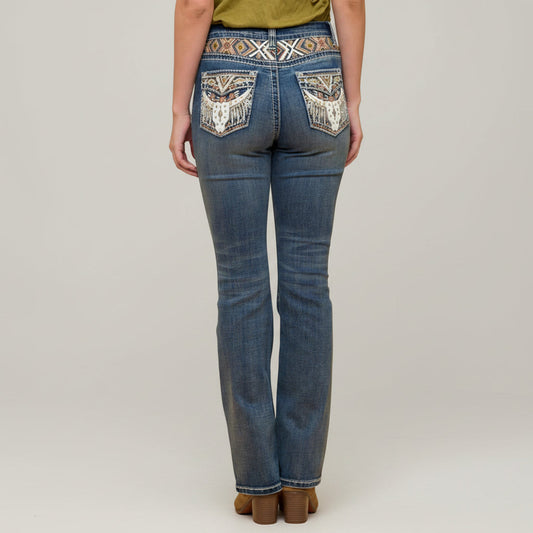 Blue embroidered bootcut jeans with ornate back yoke pocket detail.