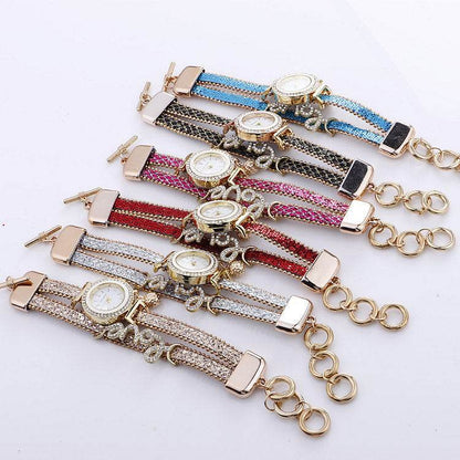 Set of rhinestone bracelet watches with round faces on striped leather straps