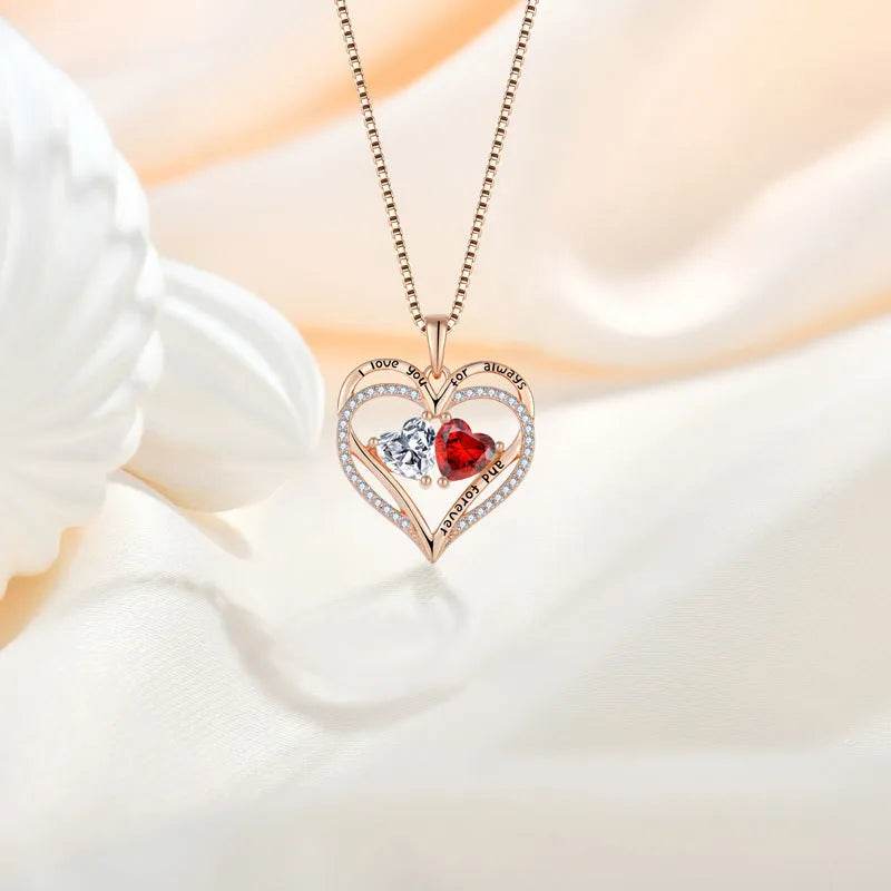 Double heart pendant necklace with red heart crystal, clear stone, and rhinestone edges