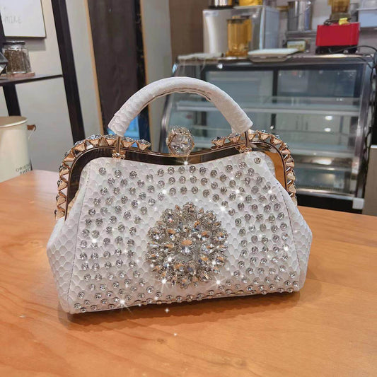 Diamond-inlaid crossbody handbag for women, white rhinestones with jeweled flower front.