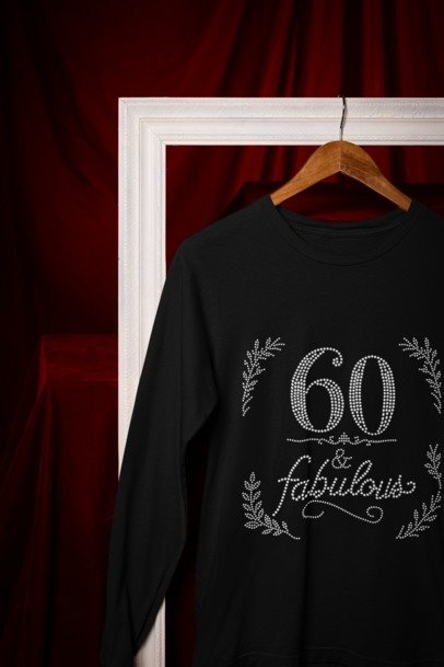 Black long-sleeve rhinestone graphic shirt with '60 & Fabulous' floral design