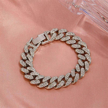Silver cuban chain bracelet with oval diamond-look links and hinge clasp