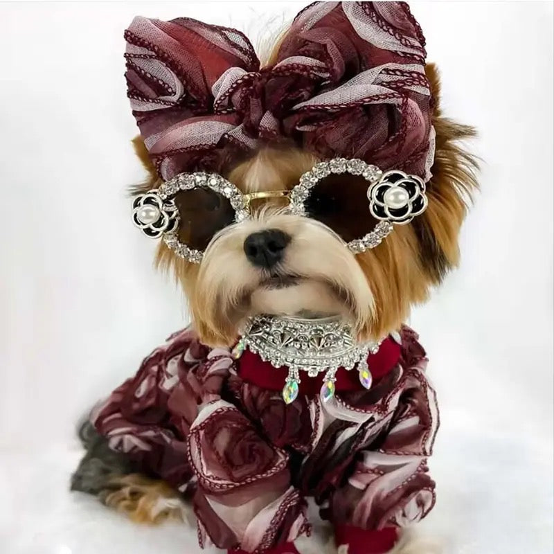 Rhinestone pet dog sunglasses with dark lenses, silver frames, and decorative bows