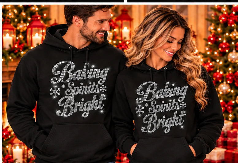 Black hoodie with pouch pocket and silver rhinestone “Baking Spirits Bright” design