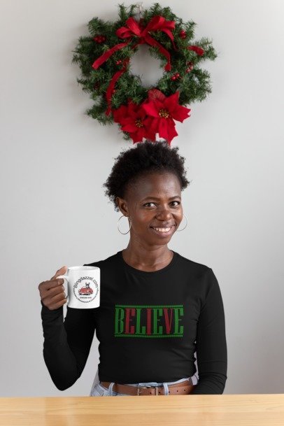 Black long-sleeve shirt with green rhinestone 'BELIEVE' front print