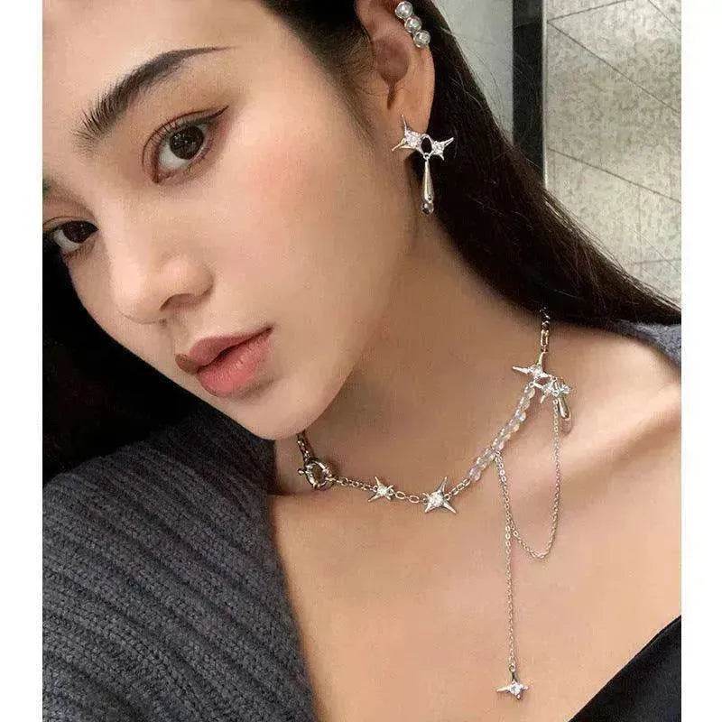 Silver star pendant necklace with star charms and a long dangling star pendant