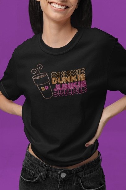 Person wearing a black t-shirt with 'Dunkie Junkie' design on a purple background
