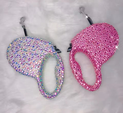 Heart-shaped rhinestone retractable dog leash retractor, pink and iridescent