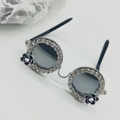 Rhinestone oval sunglasses for pets with black lenses and silver-tone hinges