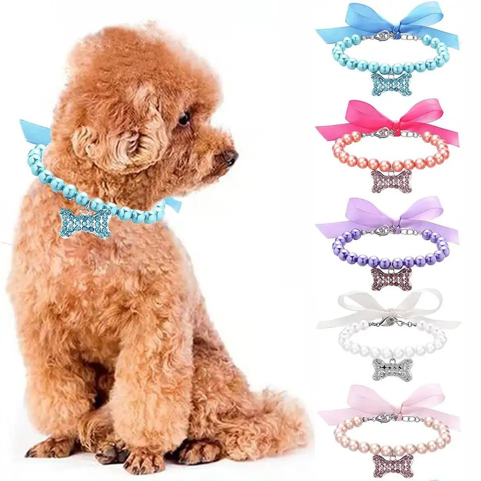 Turquoise pearl rhinestone dog collar with blue bow and dangling bone charm