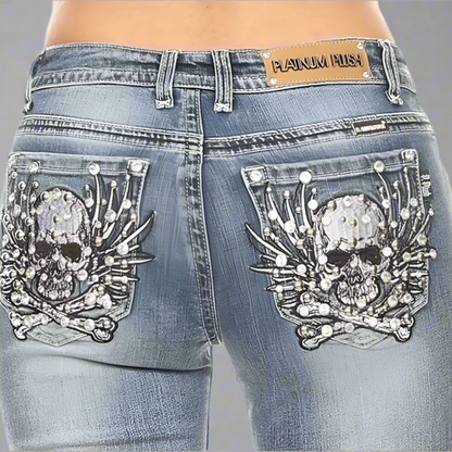 Platinum Plush women's jeans, back waistband label and rhinestone skull-and-bones pocket art
