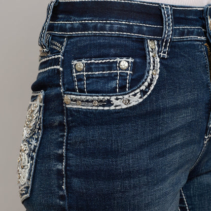 Dark wash denim bootcut jeans with embellished back pocket flap and silver-tone studs