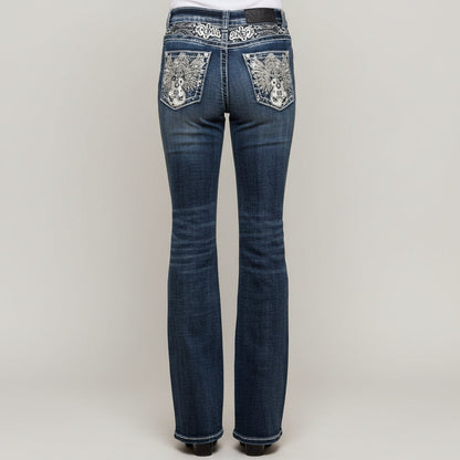 Dark wash high-waisted bootcut jeans with rhinestone guitar and music-note pocket details