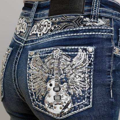 Front pocket with silver-tone sequined guitar graphic and snap-button flap