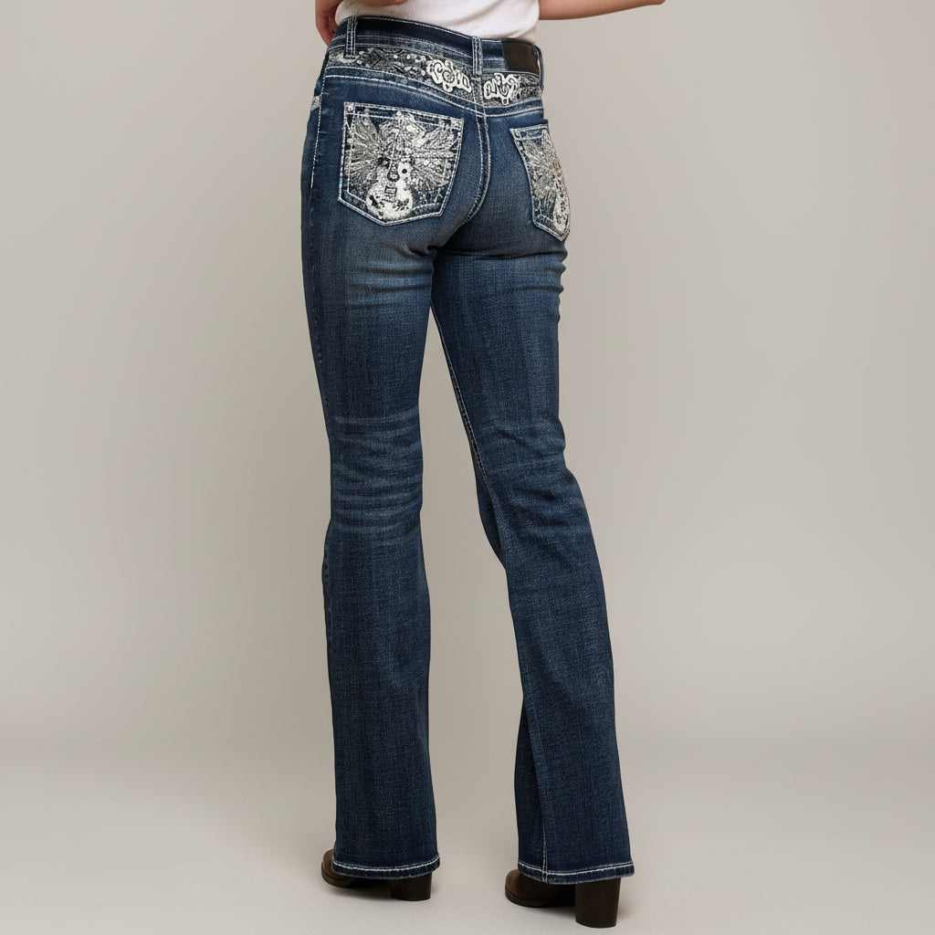 Dark wash high-waisted bootcut jeans with rhinestone guitar pocket artwork