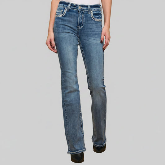 Blue jeans worn by a person on a gray background