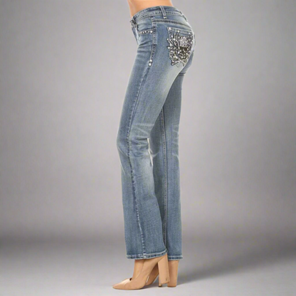 Platinum Plush women's bootcut jeans, side view with rhinestone skull pocket design