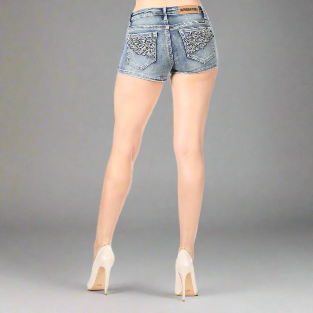 Women's blue denim shorts with rhinestone wing patches on back pockets