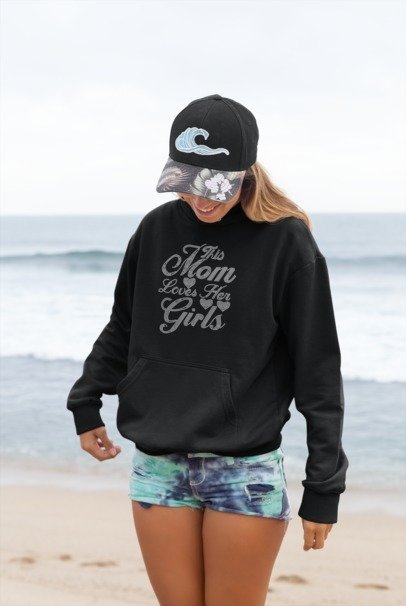 Black hooded sweatshirt with rhinestone-style "This Mom Loves Her Girls" front
