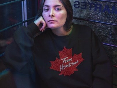 Black long-sleeve T-shirt with red rhinestone maple leaf logo on chest