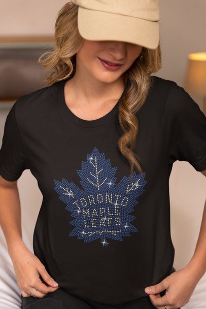 Person wearing a black t-shirt with a Toronto Maple Leafs logo