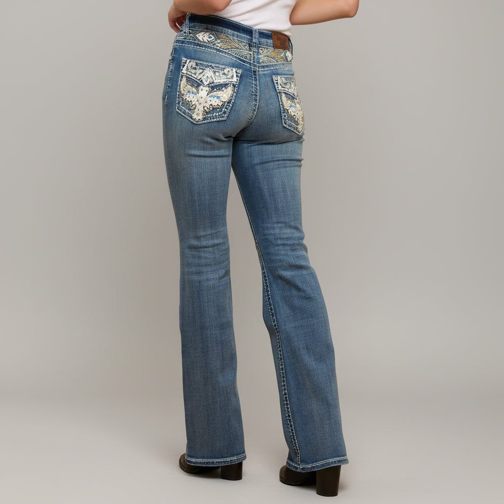 Blue denim bootcut jeans back view with embroidered back pockets and belt loops