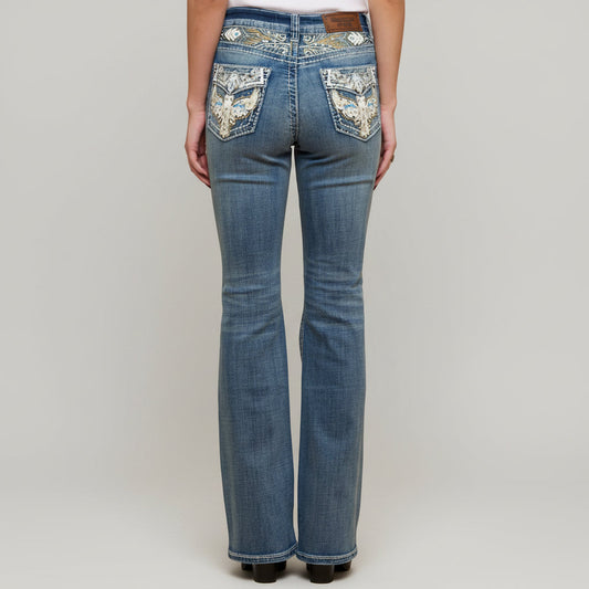 Blue denim bootcut jeans with jeweled eagle embroidery on front pockets