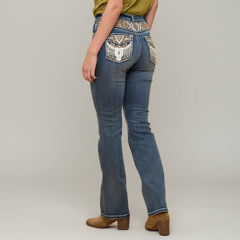 Blue bootcut jeans with embroidered back yoke pocket and stitched back seams.