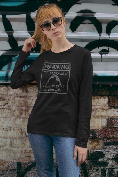 Black long sleeve shirt with warning gymnast rhinestone graphic and long sleeves, side view