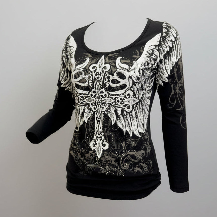 Black long-sleeve top with white lace and wing design on a gray background
