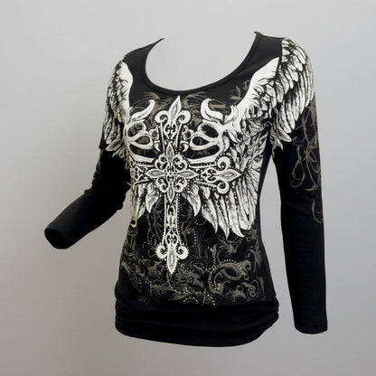 Black long-sleeve top with white lace and wing design on a gray background