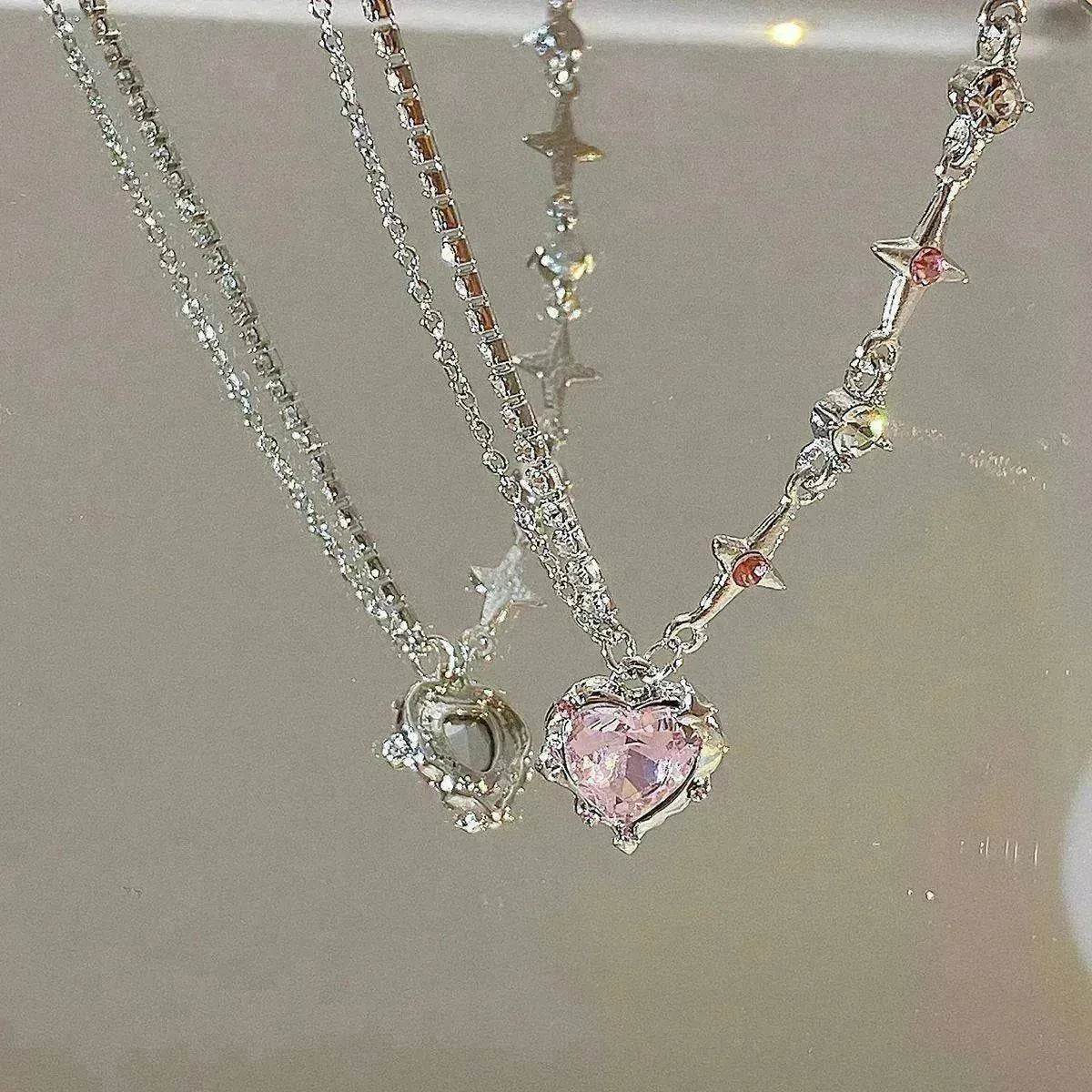 Silver-tone necklace with pink heart pendant and small crystal charms
