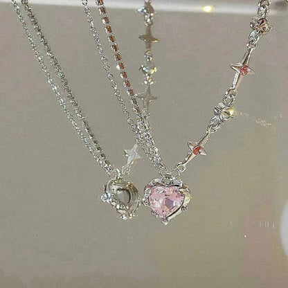 Silver-tone necklace with pink heart pendant and small crystal charms