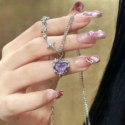 Silver-tone necklace with purple heart pendant and matching sparkle chain