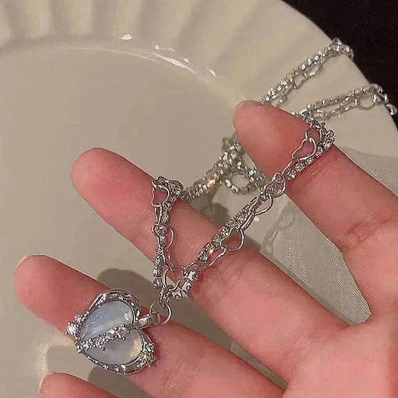 Silver-tone necklace with lilac heart pendant and dangling crystal charms