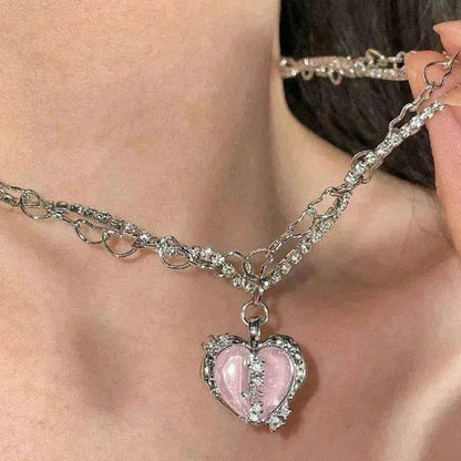 Silver-tone choker-style necklace with pink heart pendant center